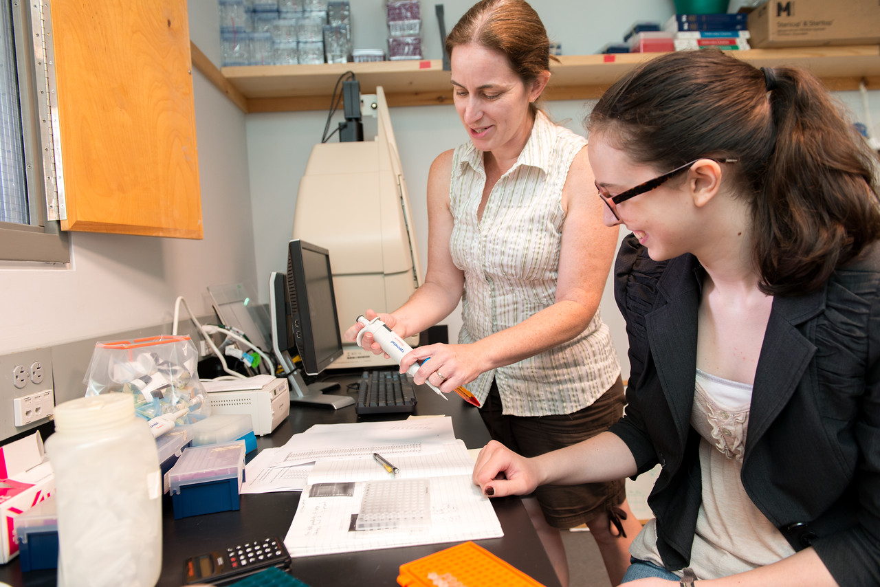 Erin McMullin and student in lab setting