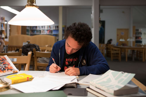 Academy student studying in the library