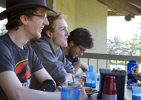 Students eating on dining hall balcony